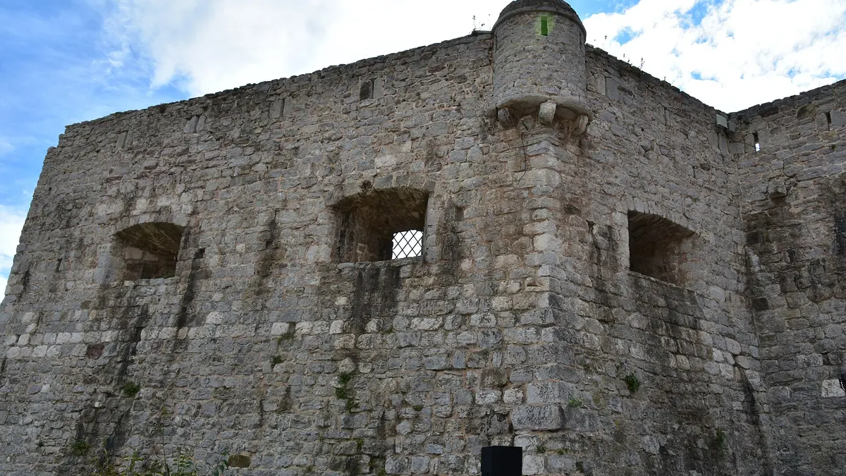 The stone walls and citadel of Budva old town jutting into the Adriatic