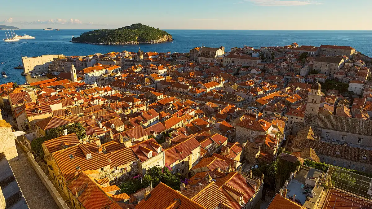 The red-tiled roofs of Dubrovnik old town inside its sea walls, seen from above