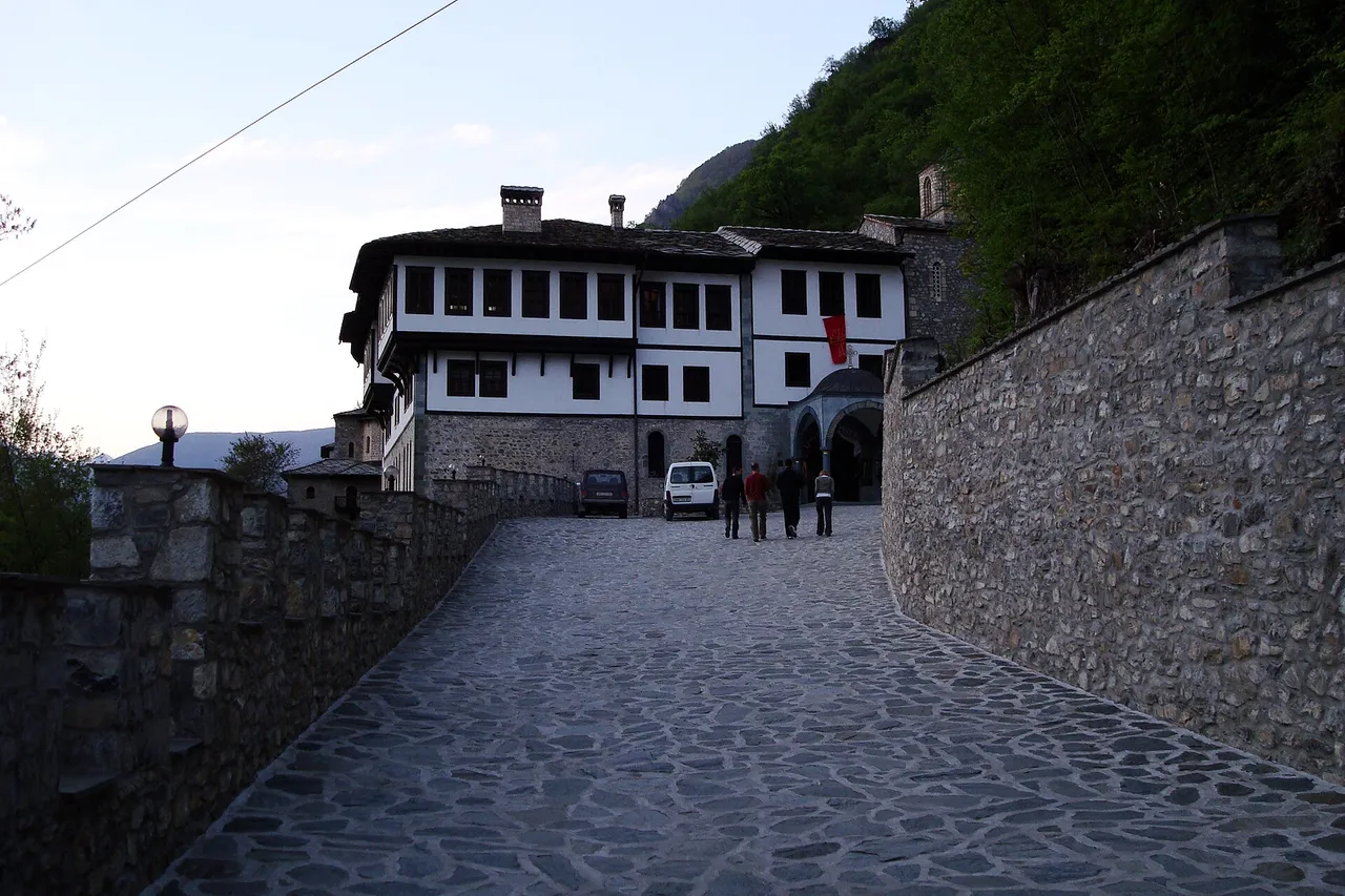 Timber balconies and stone church of Sveti Jovan Bigorski monastery in the Radika valley