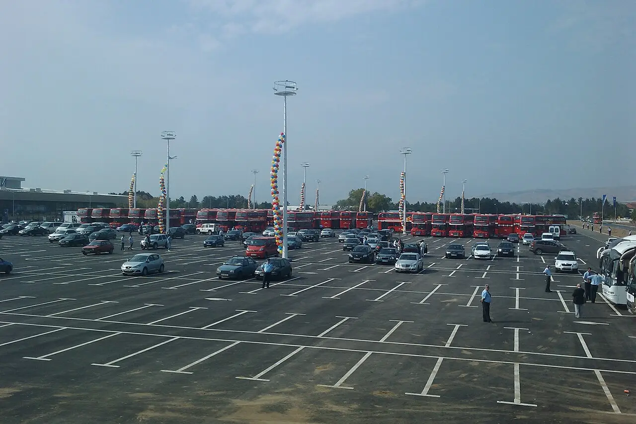 The car park outside Skopje airport terminal with rows of parked cars
