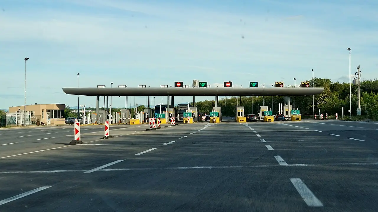 A toll plaza on a North Macedonian motorway with lanes marked CASH and MTAG