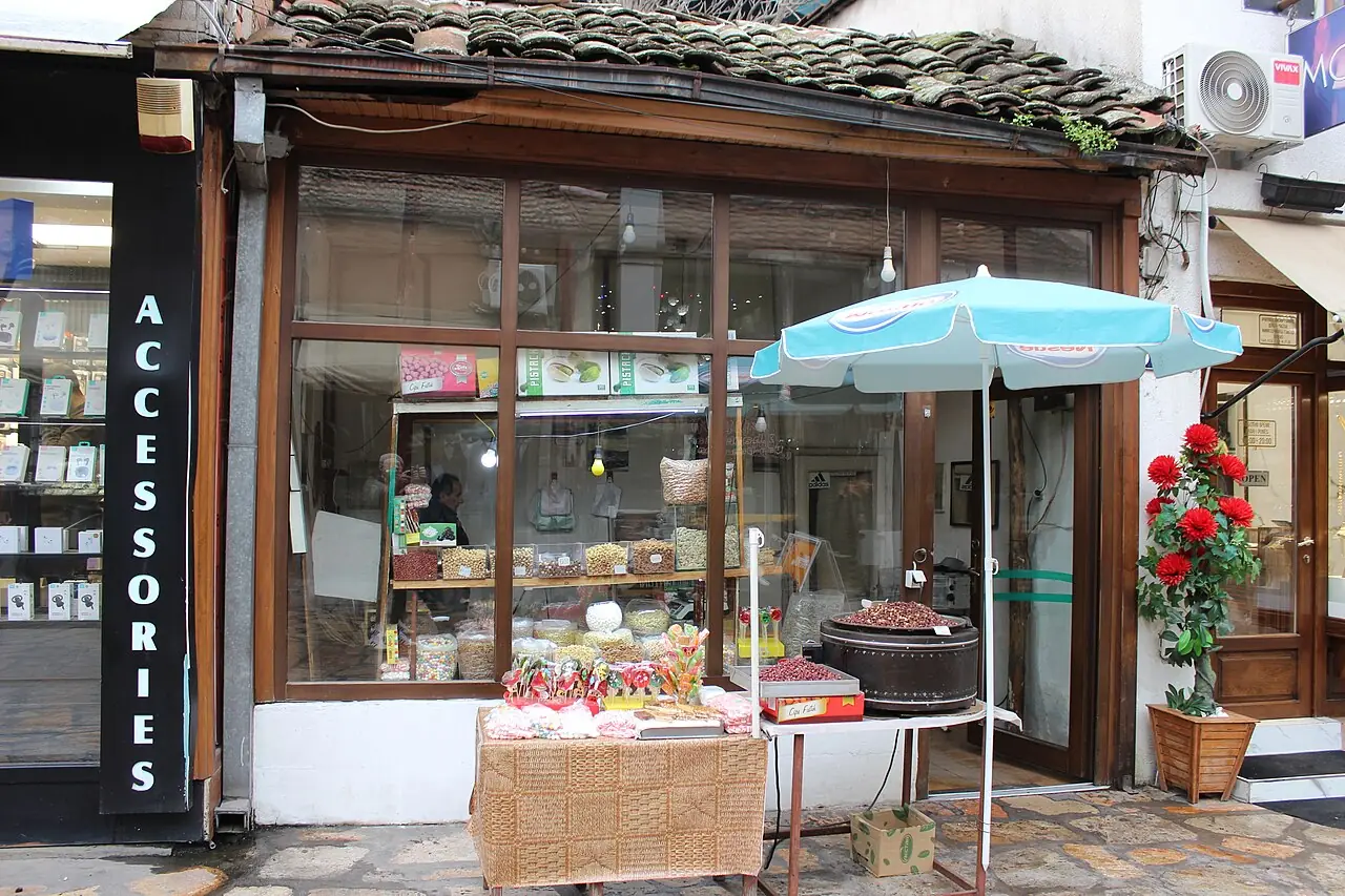 A traditional candy shop in Skopje Old Bazaar with jars of sweets stacked in the window