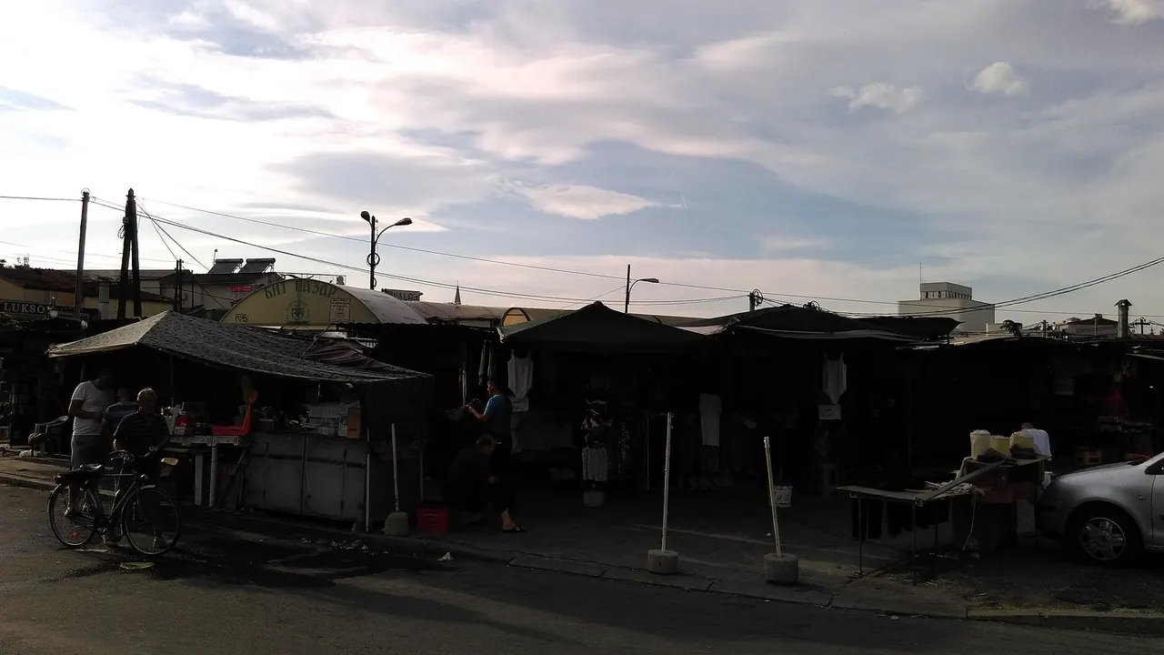 Stalls of fruit, vegetables and sacks of produce at Bit Pazar, Skopje's open-air green market