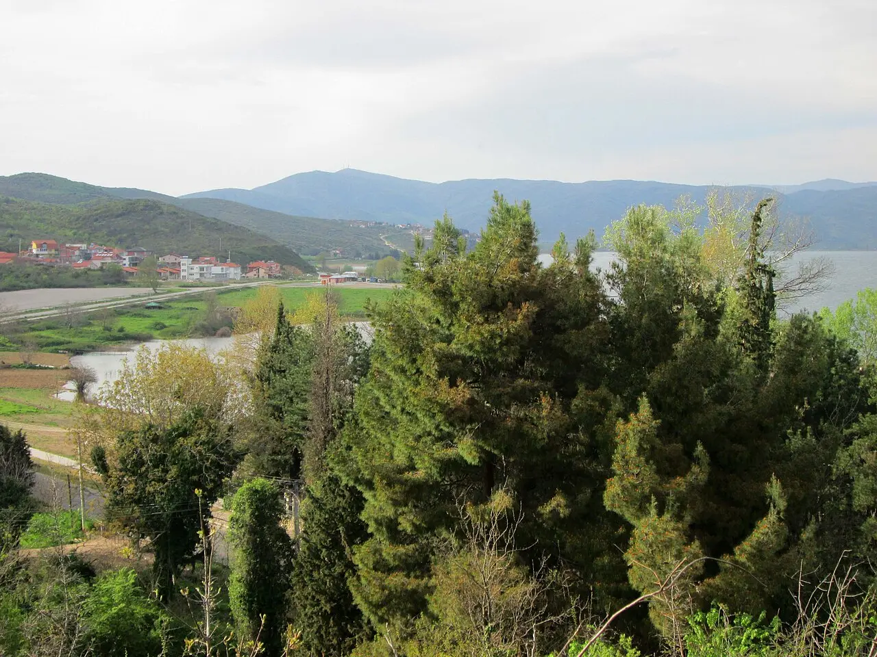 View over Lake Dojran with the town and green hills in the distance