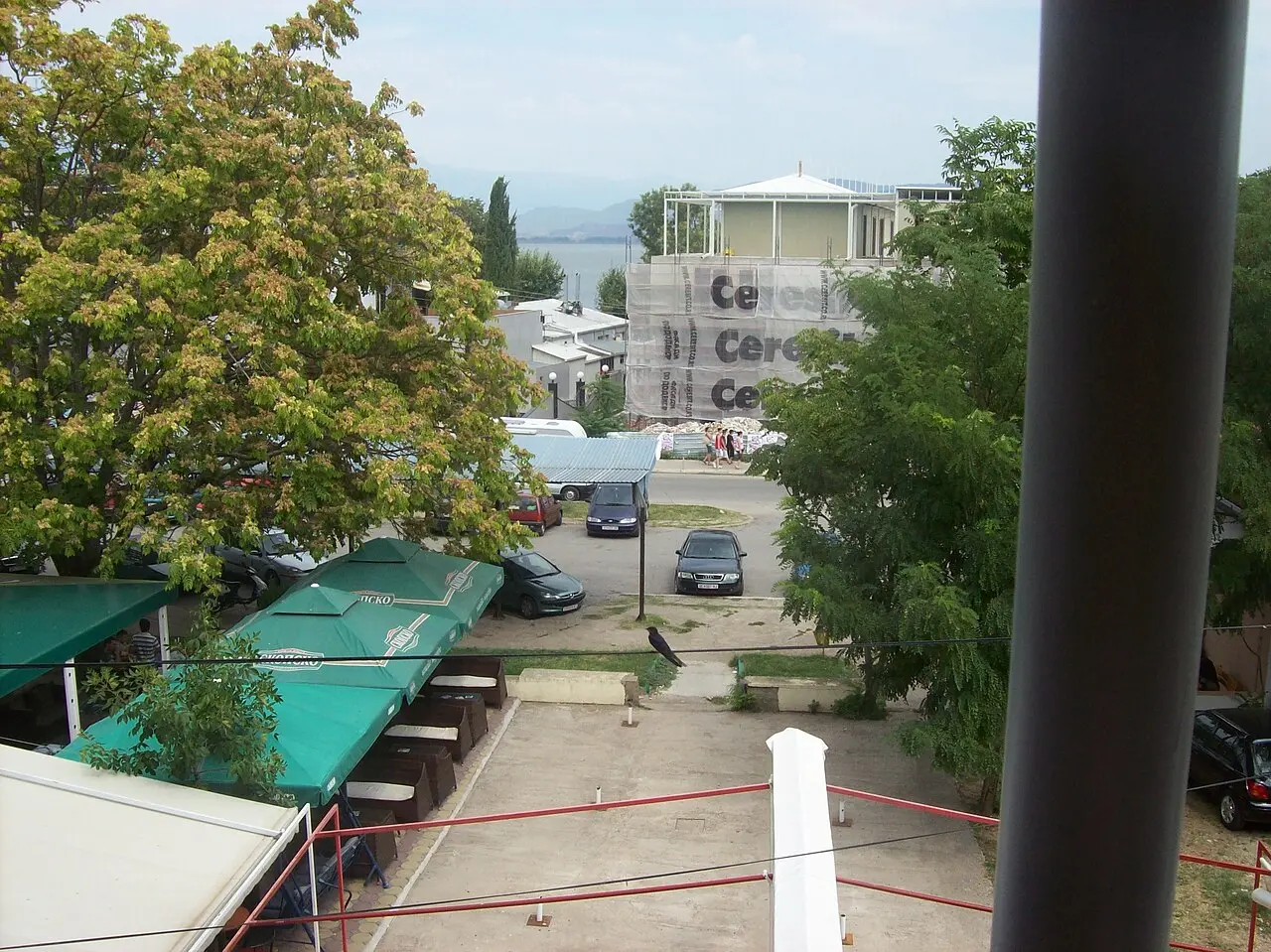 Lakeside buildings and trees along the shore at Star Dojran