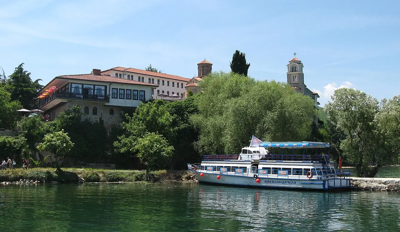 The Monastery of St. Naum seen from Lake Ohrid, on a wooded headland above the water