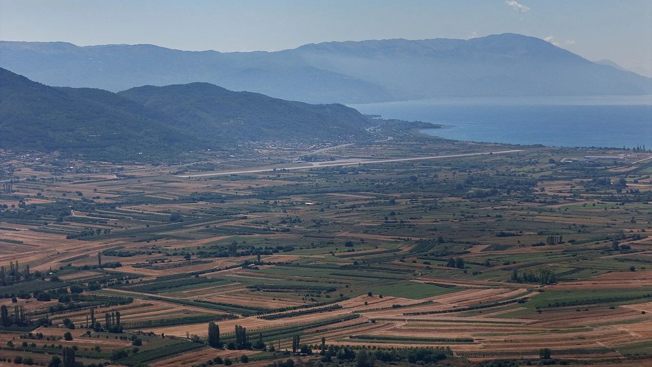 The terminal of Ohrid St. Paul the Apostle Airport with the control tower under a clear sky