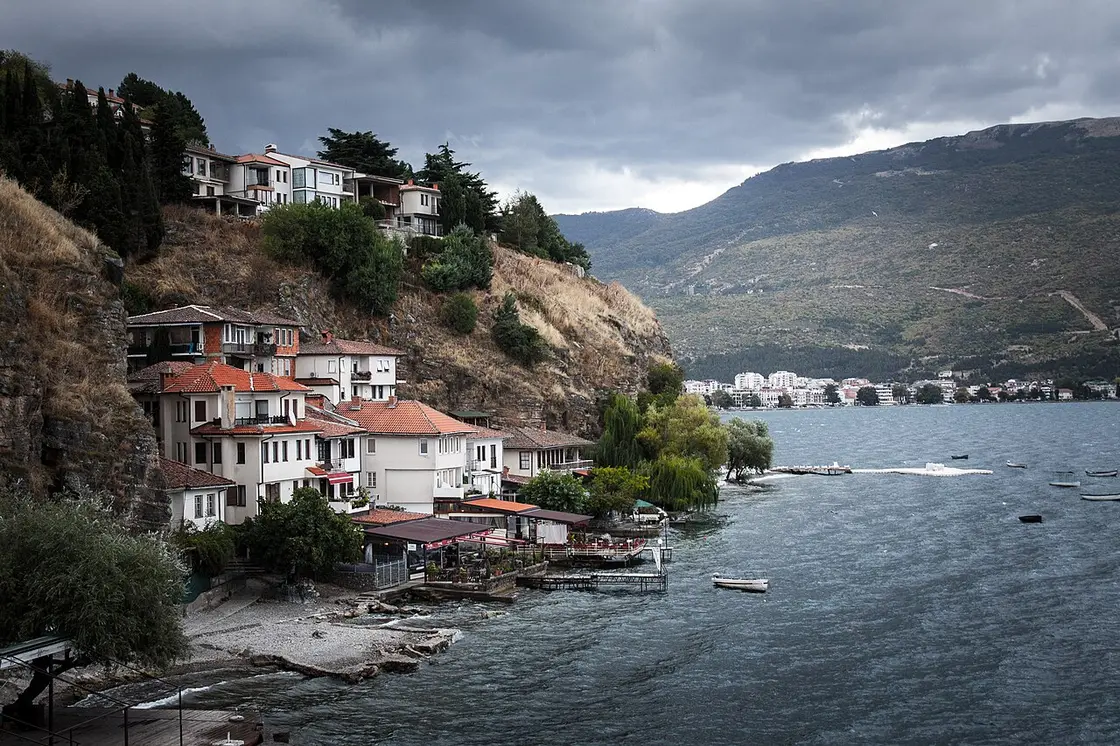 White houses with red roofs of the Kaneo fishing quarter perched on the cliffs above Lake Ohrid