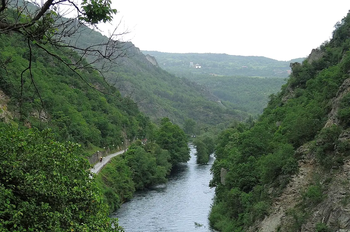 The green Treska river winding through the wooded Matka Canyon near Skopje