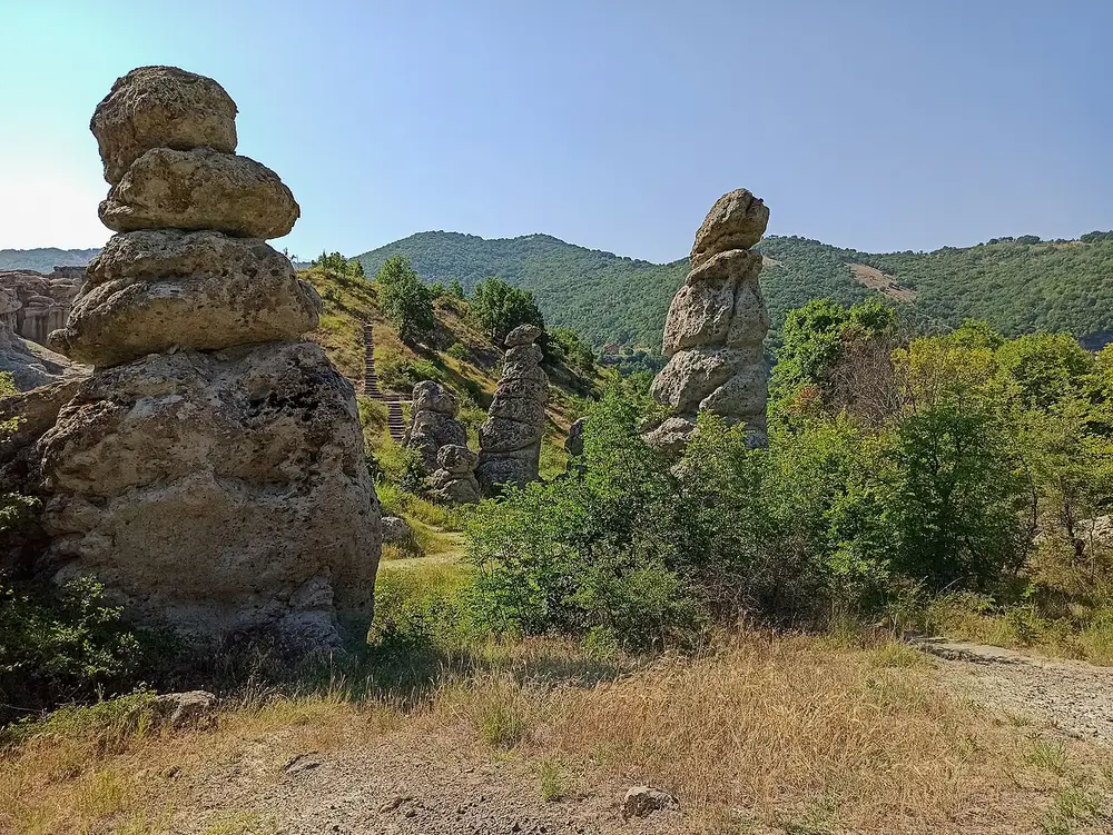 Two eroded pillars at Kuklica, each topped with a slab of harder rock acting as a natural cap