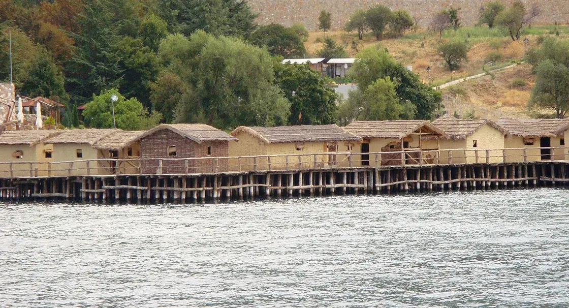 The reconstructed prehistoric pile-dwelling settlement of the Bay of Bones built on stilts over Lake Ohrid, seen from the water