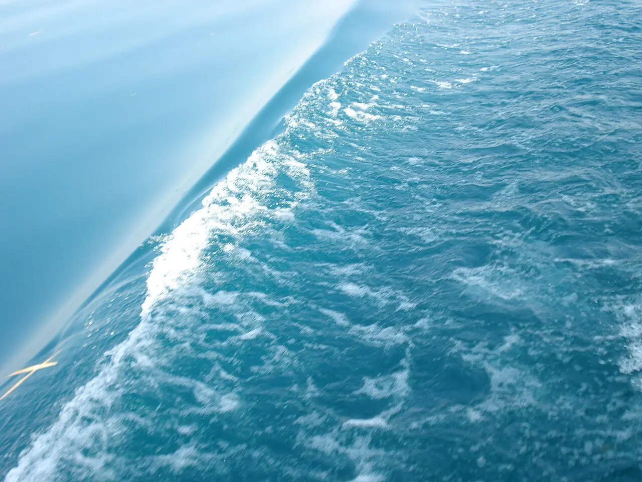 Close-up of the clear turquoise water of Lake Ohrid catching the light