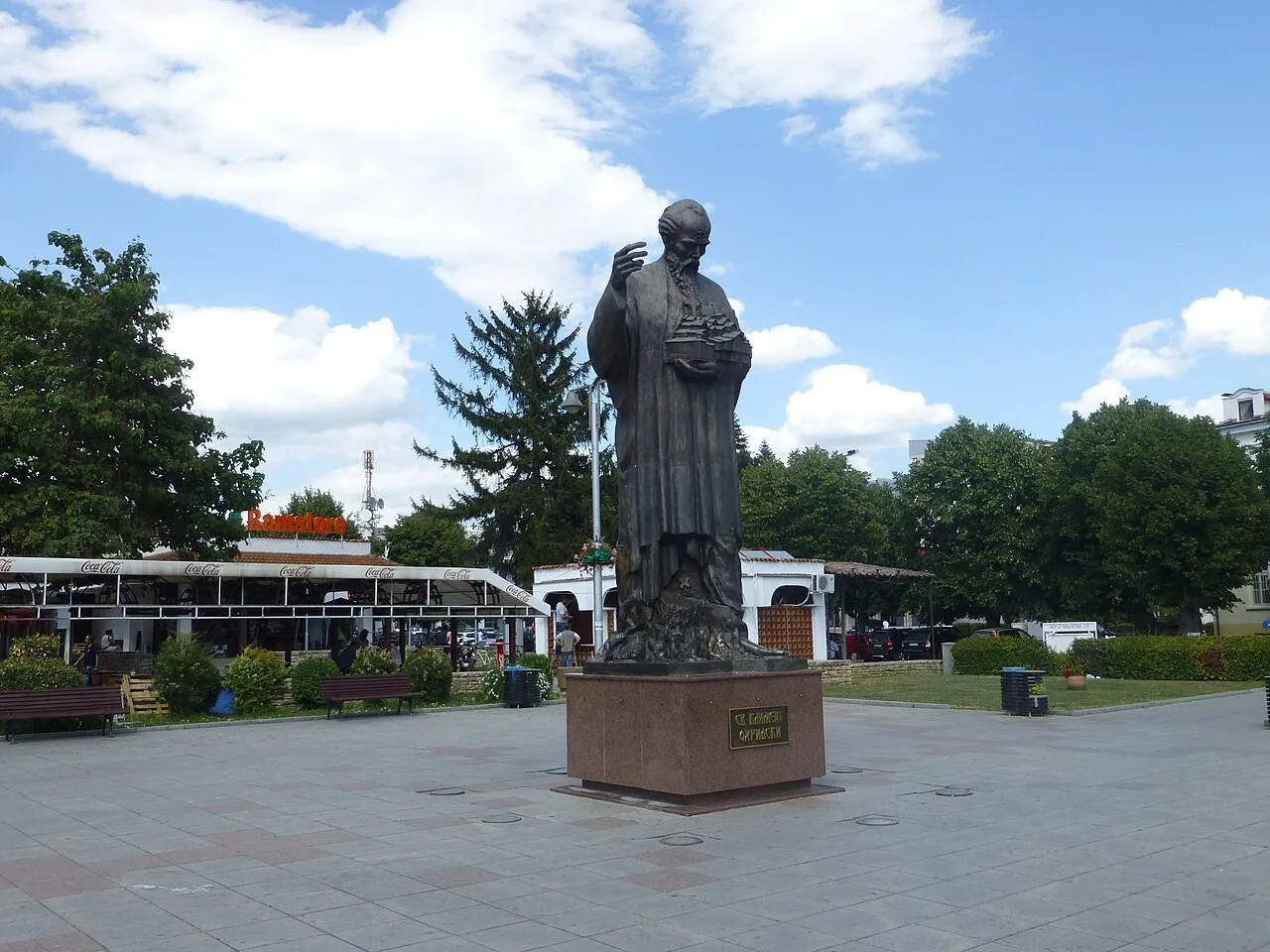 Ohrid harbour square with the bronze statue of St Clement and lakeside kiosks behind