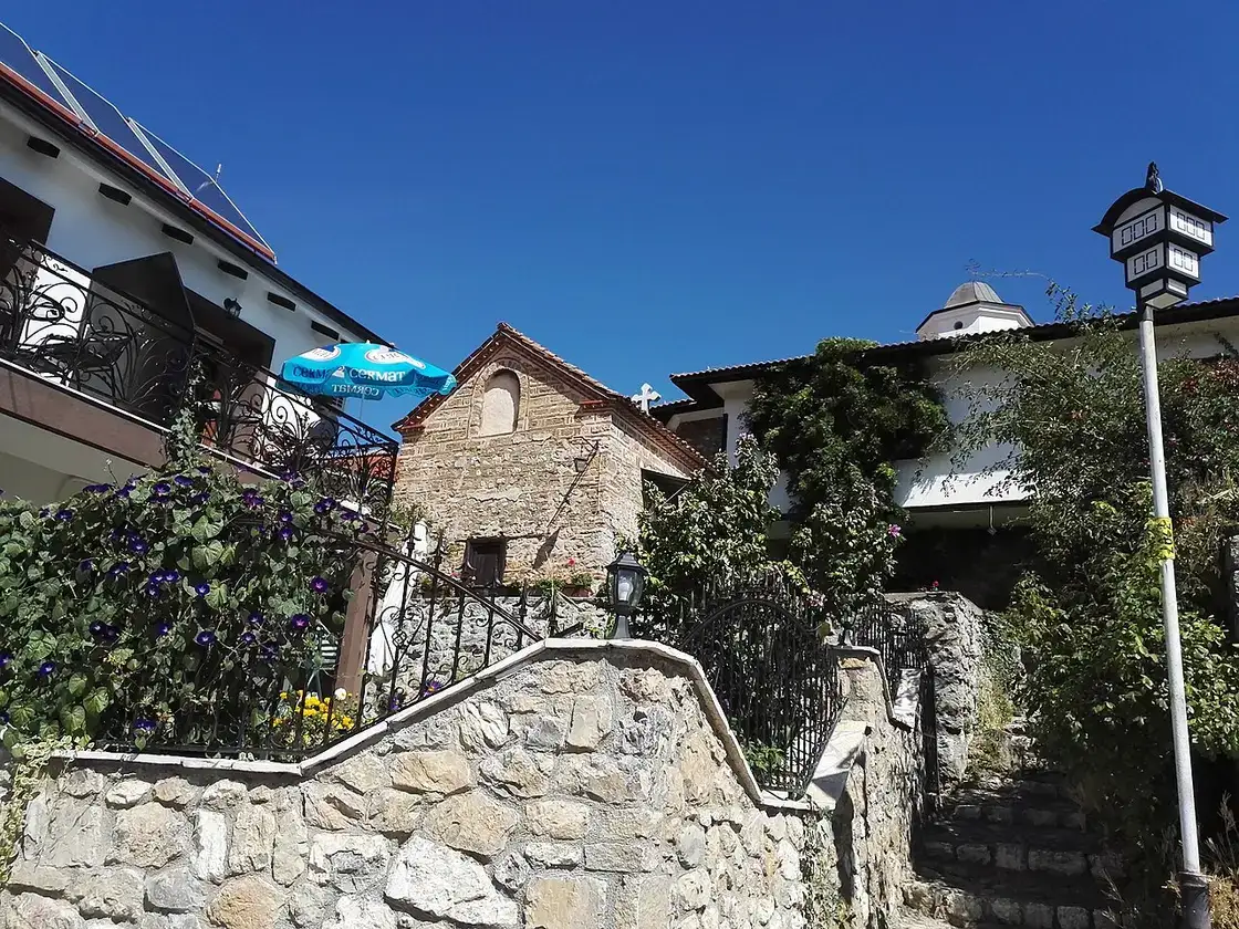 Narrow residential street with parked cars in Ohrid