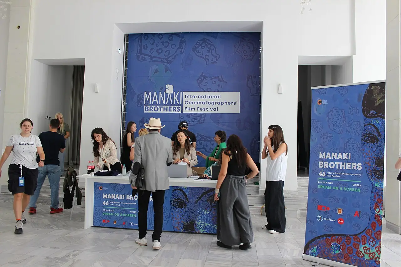 Festival staff preparing signage and equipment before the Manaki Brothers festival in Bitola