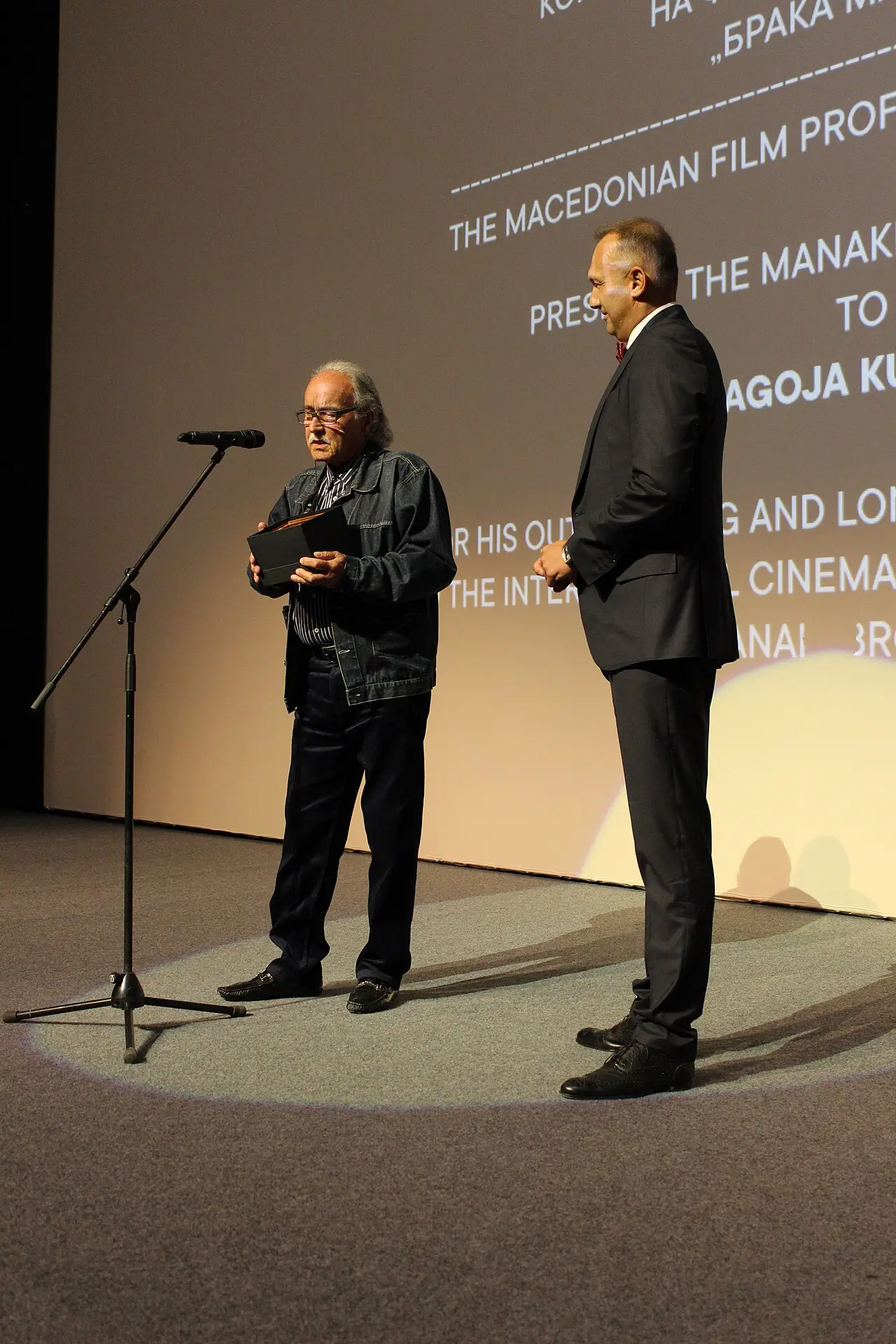 Blagoja Kunovski-Dore receiving the Manaki Brothers Golden Medal award on stage in Bitola