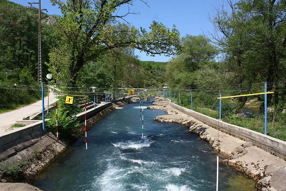 A whitewater kayak slalom channel with hanging gates on the Treska river at Matka