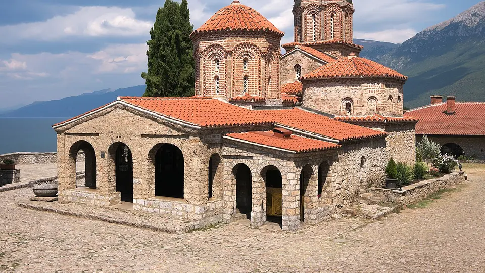 The stone church of the Monastery of St. Naum above Lake Ohrid with mountains beyond