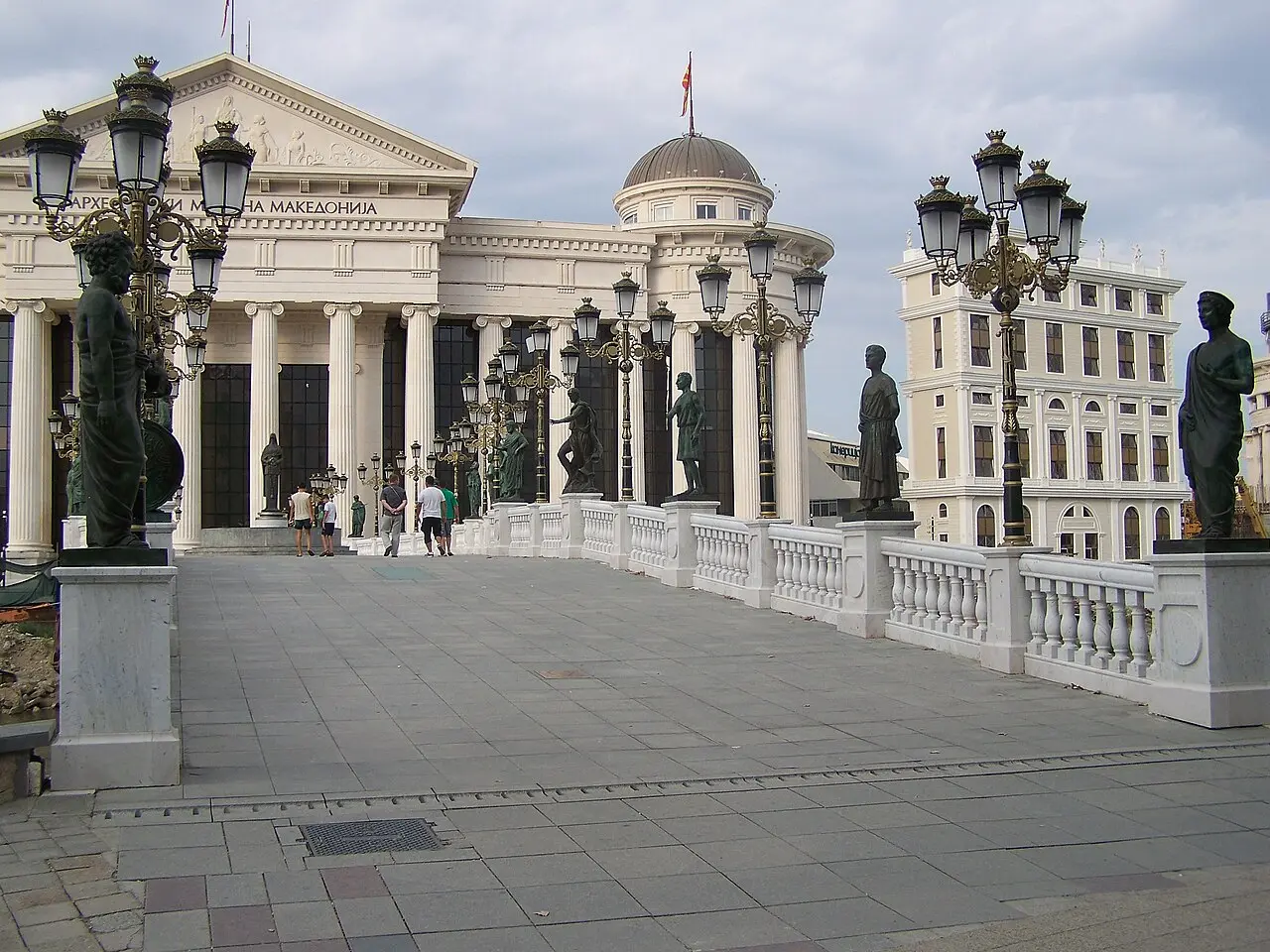 The Bridge of Civilizations over the Vardar river in central Skopje with statues along its railings