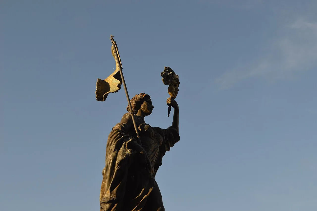 The 'Strumica Woman Under Mask' monument in Strumica's city square, a permanent tribute to the town's carnival tradition
