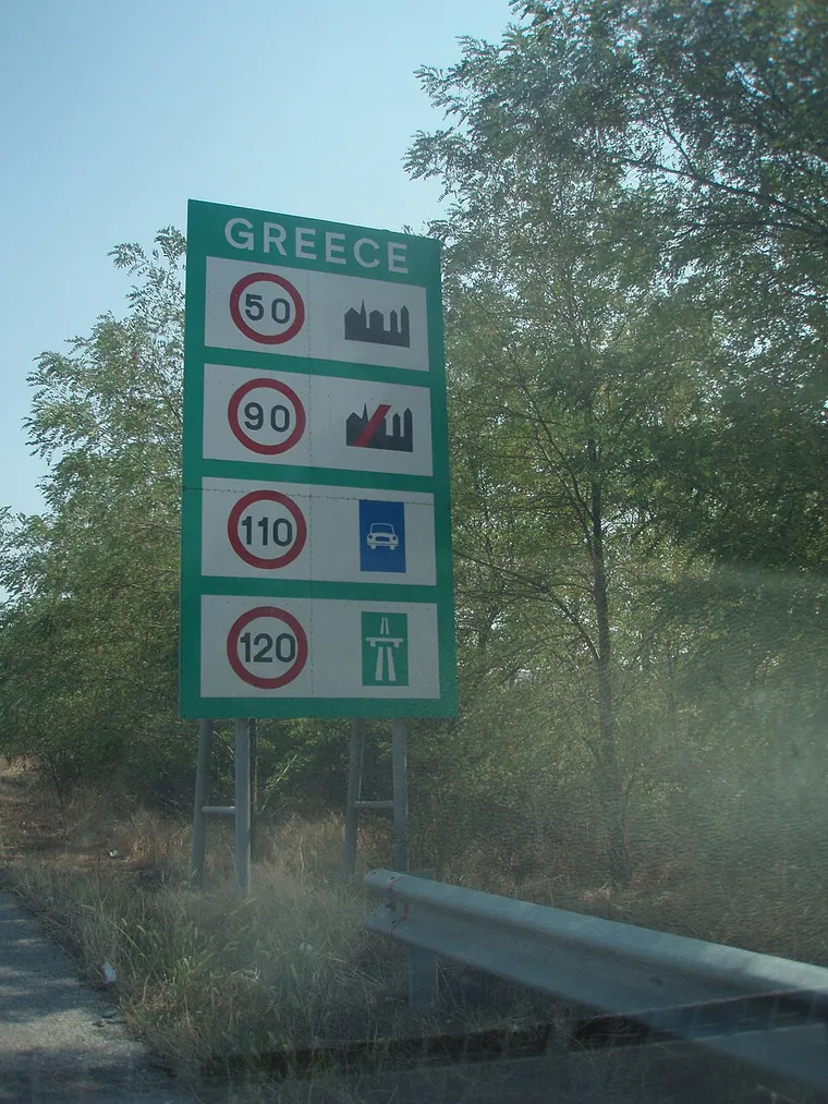 An information board on the Greek A1 motorway listing national speed limits for different vehicle types