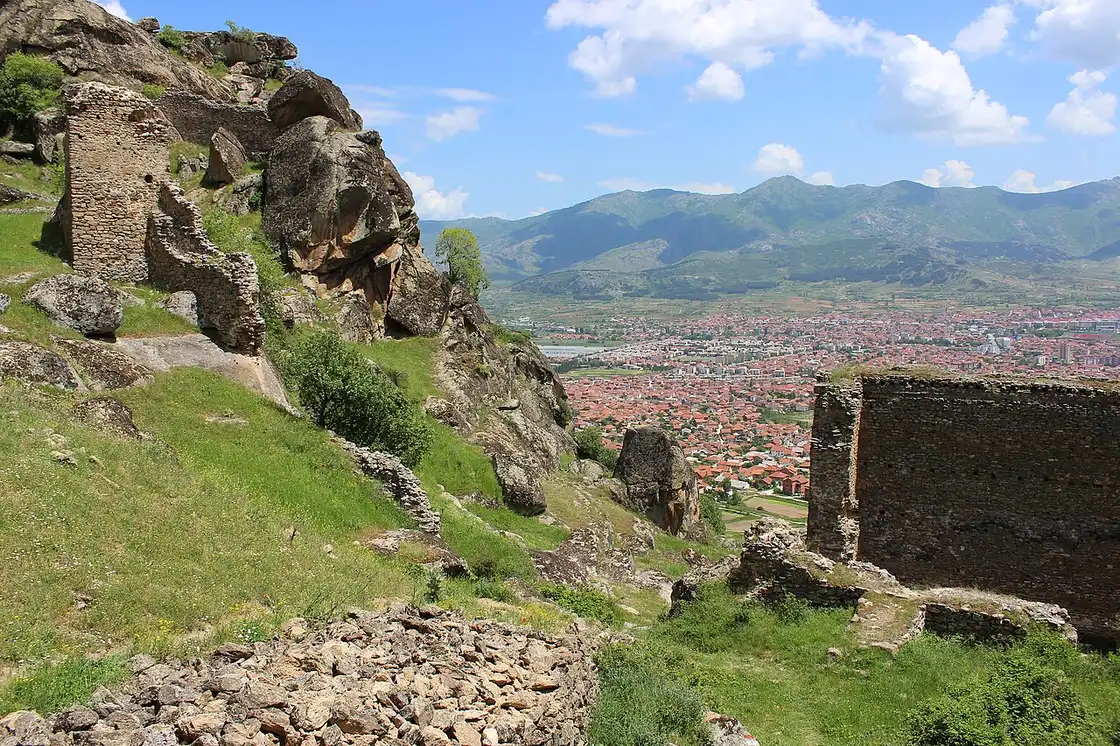 The ruined stone walls of Markovi Kuli fortress on rocky boulders above the town of Prilep