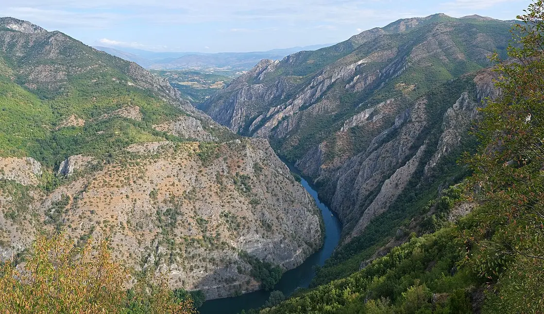 Aerial view of the deep green gorge of Matka Canyon with the Treska river winding below
