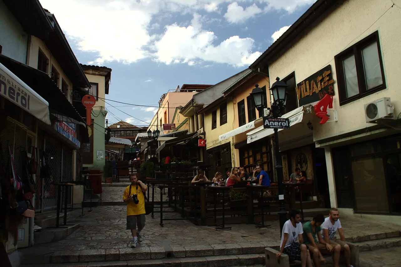 Cobbled lane and shop fronts in Skopje Old Bazaar under a clear sky