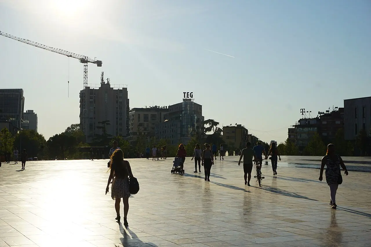 The open expanse of Skanderbeg Square in central Tirana, Albania, with surrounding buildings