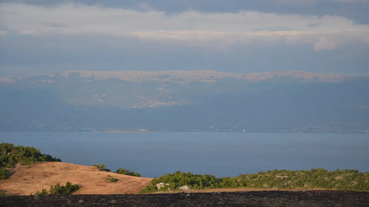 Sunny summer view across Lake Ohrid with hills on the far shore