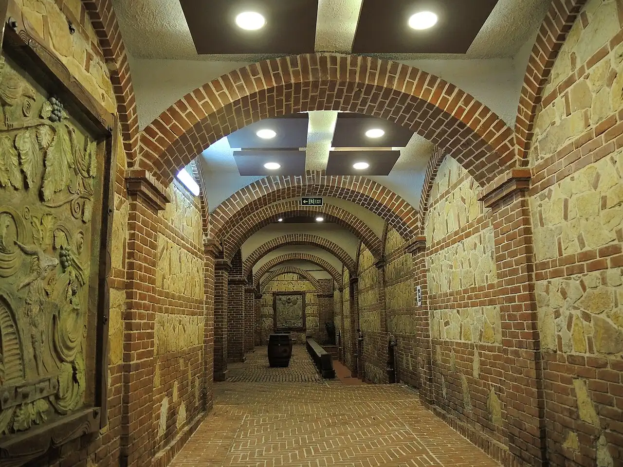 A vaulted brick-arched passage leading to the wine cellars at Tikveš Winery