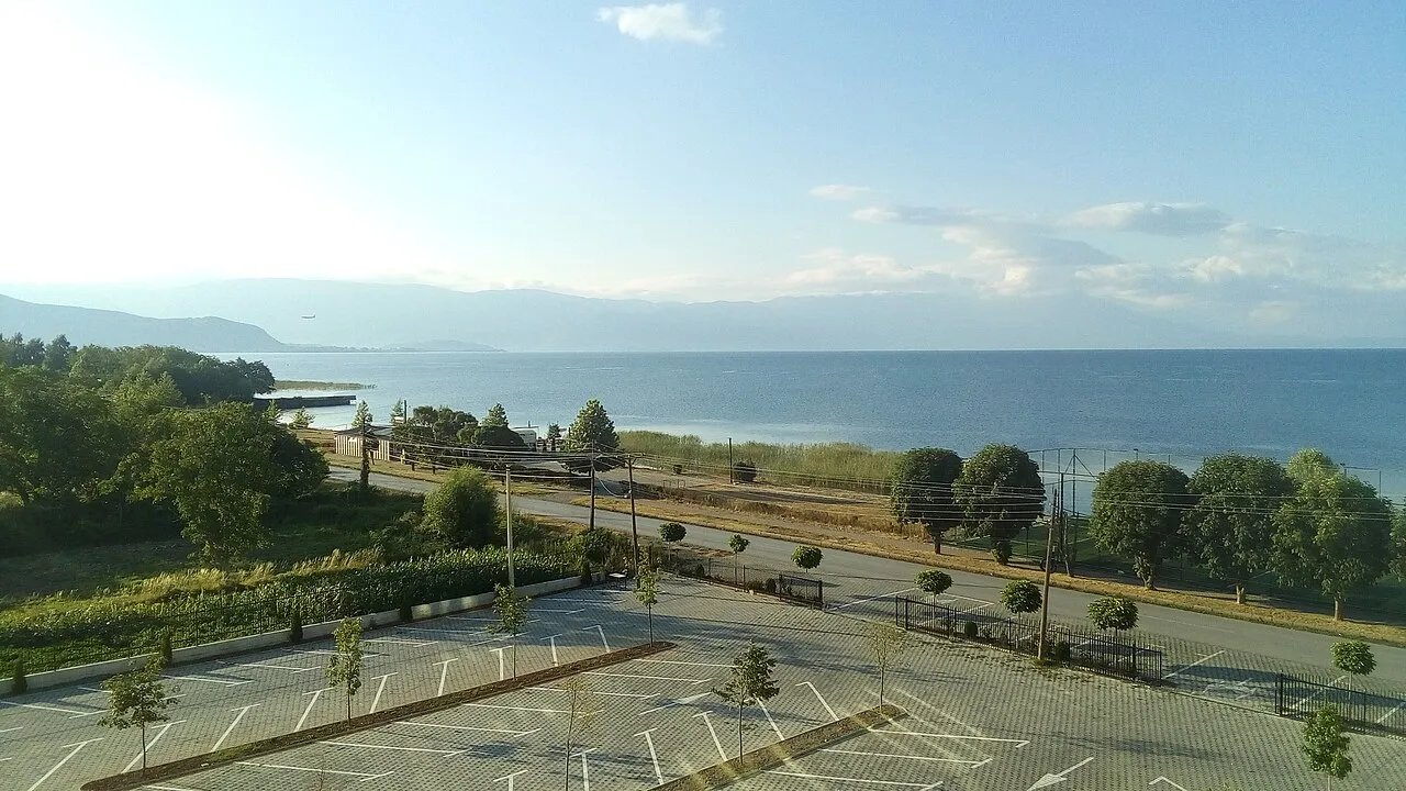 Dawn light over Lake Ohrid at Struga with still water and distant hills