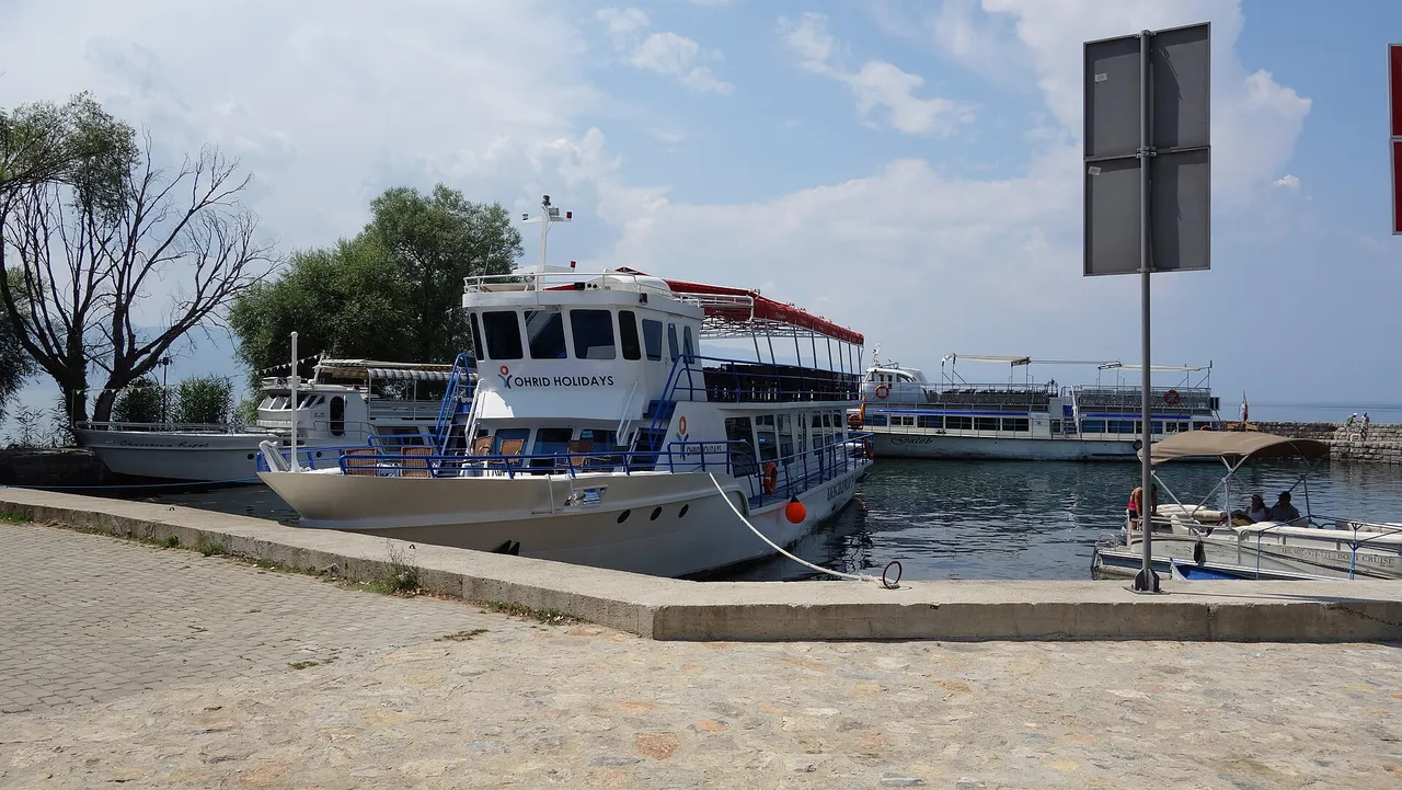 Excursion boats tied up at the jetty below the Sveti Naum monastery complex