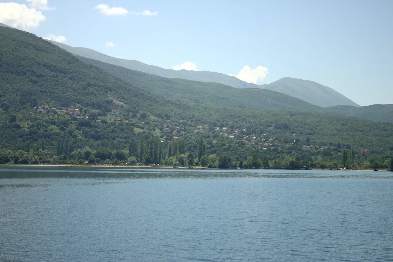 The village of Ljubanista on the Lake Ohrid shore below the Galicica mountains, seen from the water