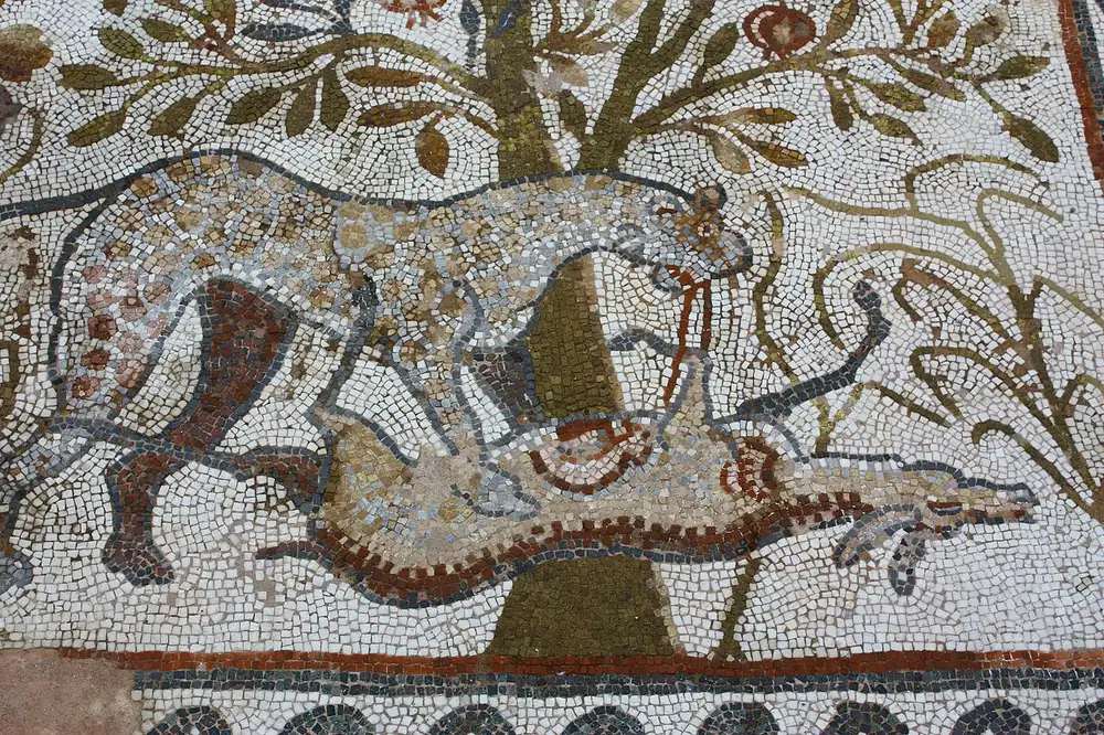 Detailed early-Christian floor mosaic with birds and plants at Heraclea Lyncestis