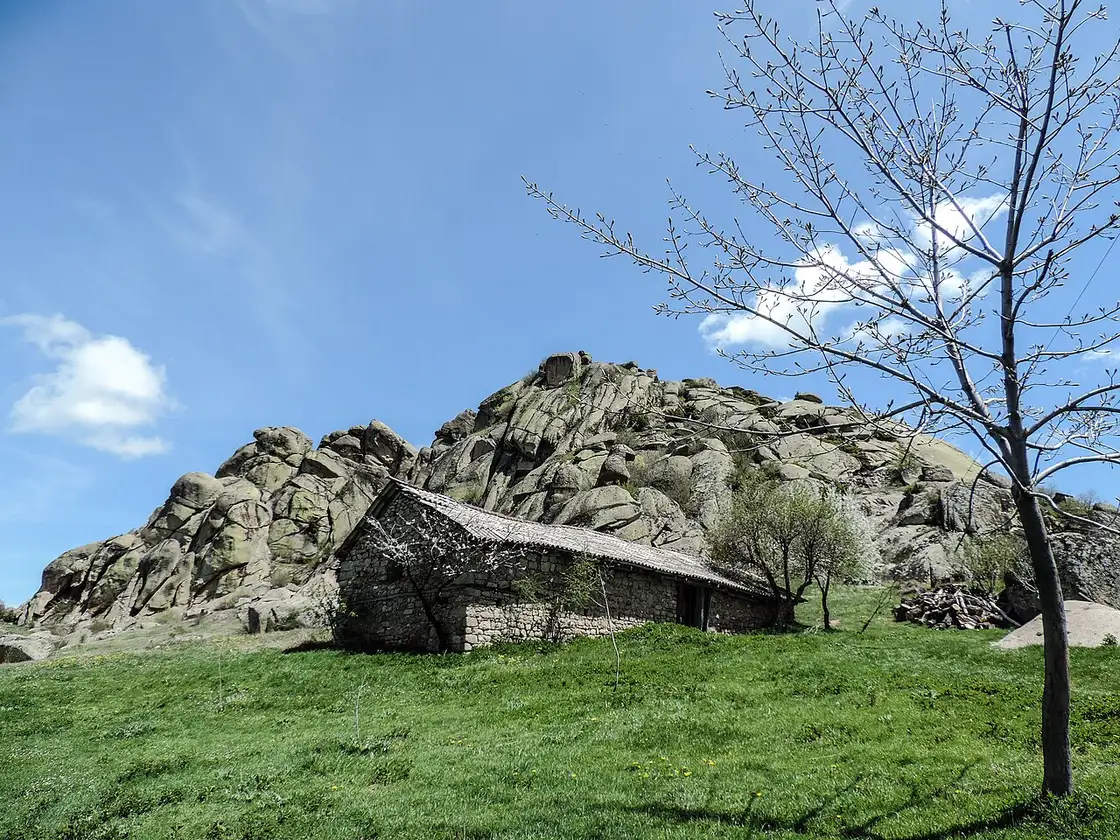 A stone building below the boulder-strewn summit of Mount Zlatovrv on the way to Treskavec monastery