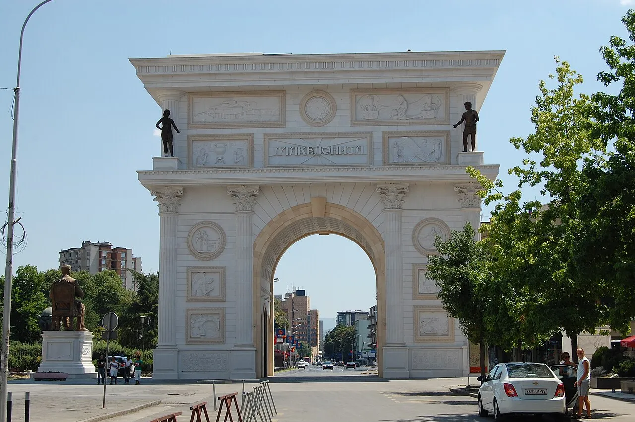 The white marble Porta Macedonia triumphal arch in central Skopje on a clear day