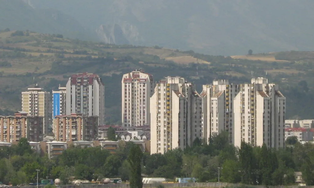 Karpoš residential tower blocks in Skopje with green mountains behind on a clear day