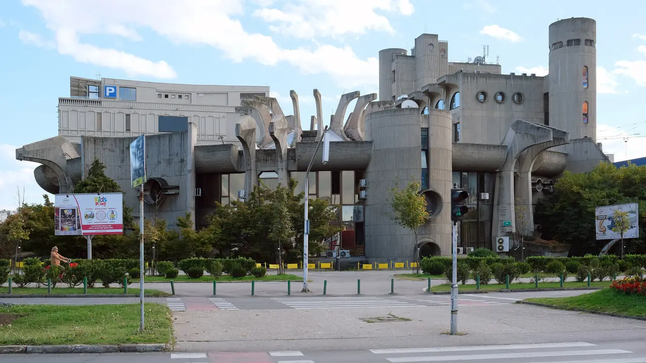 The sculptural concrete headquarters of the Post of North Macedonia beside the Vardar in Skopje