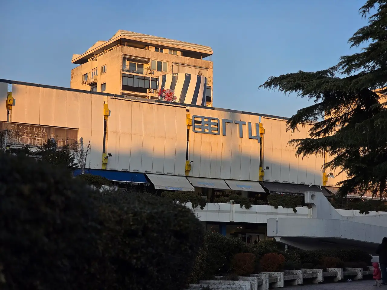 The stepped concrete terraces and shopfronts of Skopje's City Trade Center