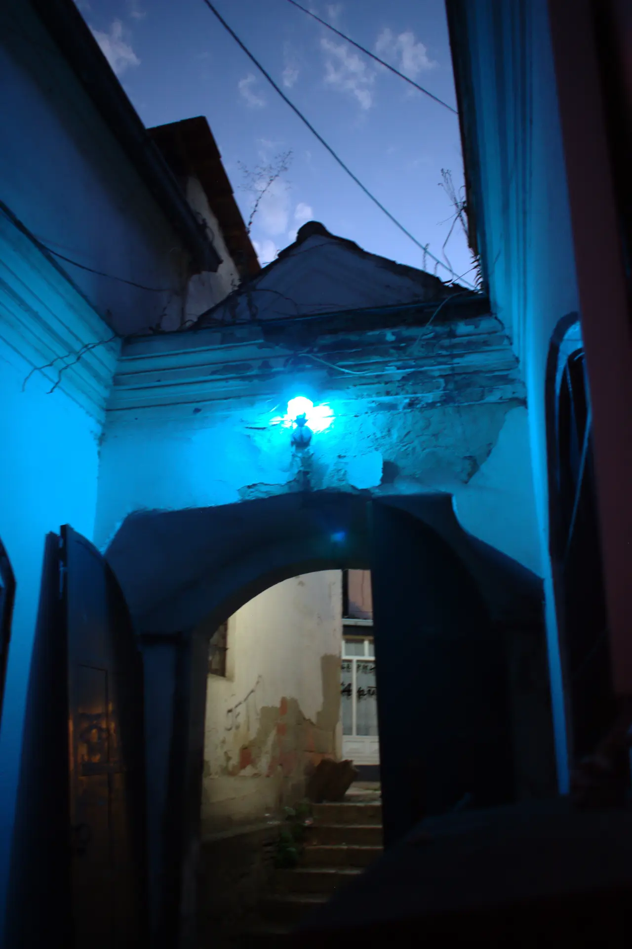 A stone gateway into the Bezisten covered market in the Skopje Old Bazaar at dusk