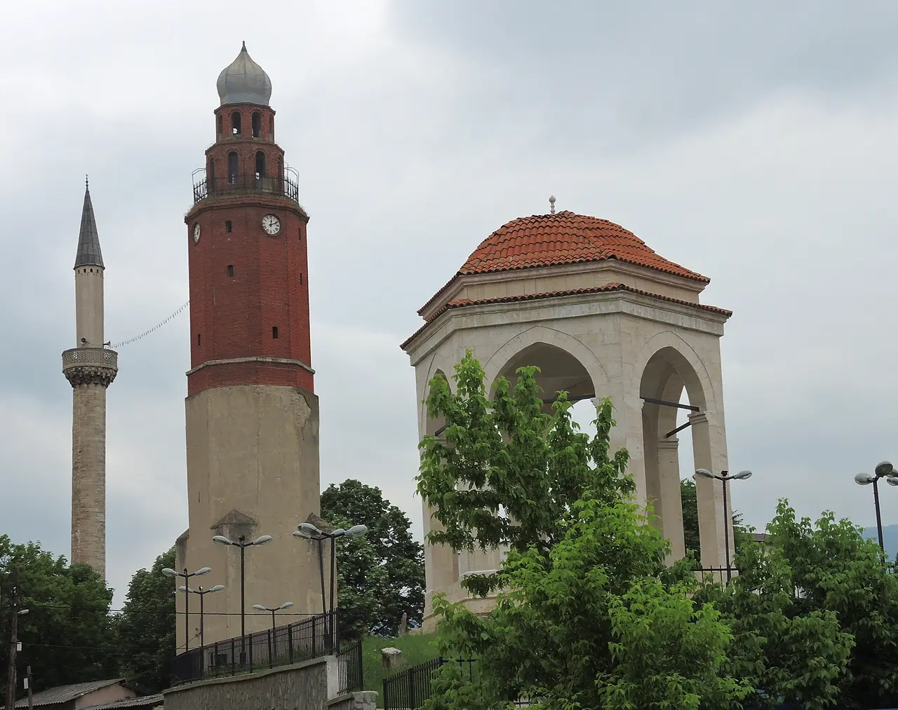 The Ottoman stone clock tower and a minaret rising over the Skopje Old Bazaar