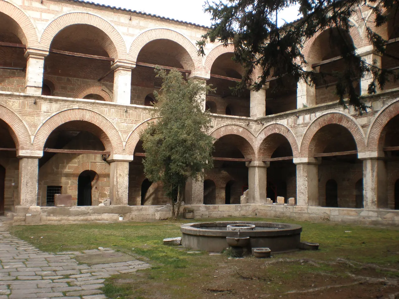 The arcaded stone courtyard of Kursumli An caravanserai in Skopje