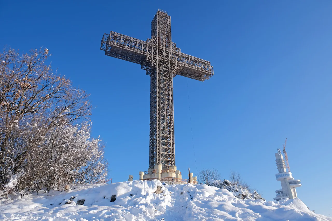 The Millennium Cross on the snowy top of Vodno in January 2025, the mountain that line 25 serves