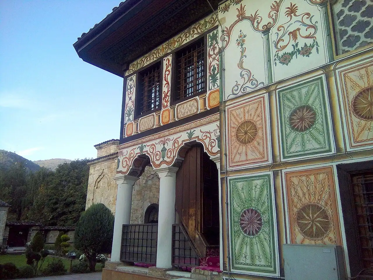 The floral-painted facade and columned porch of the Painted Mosque in Tetovo