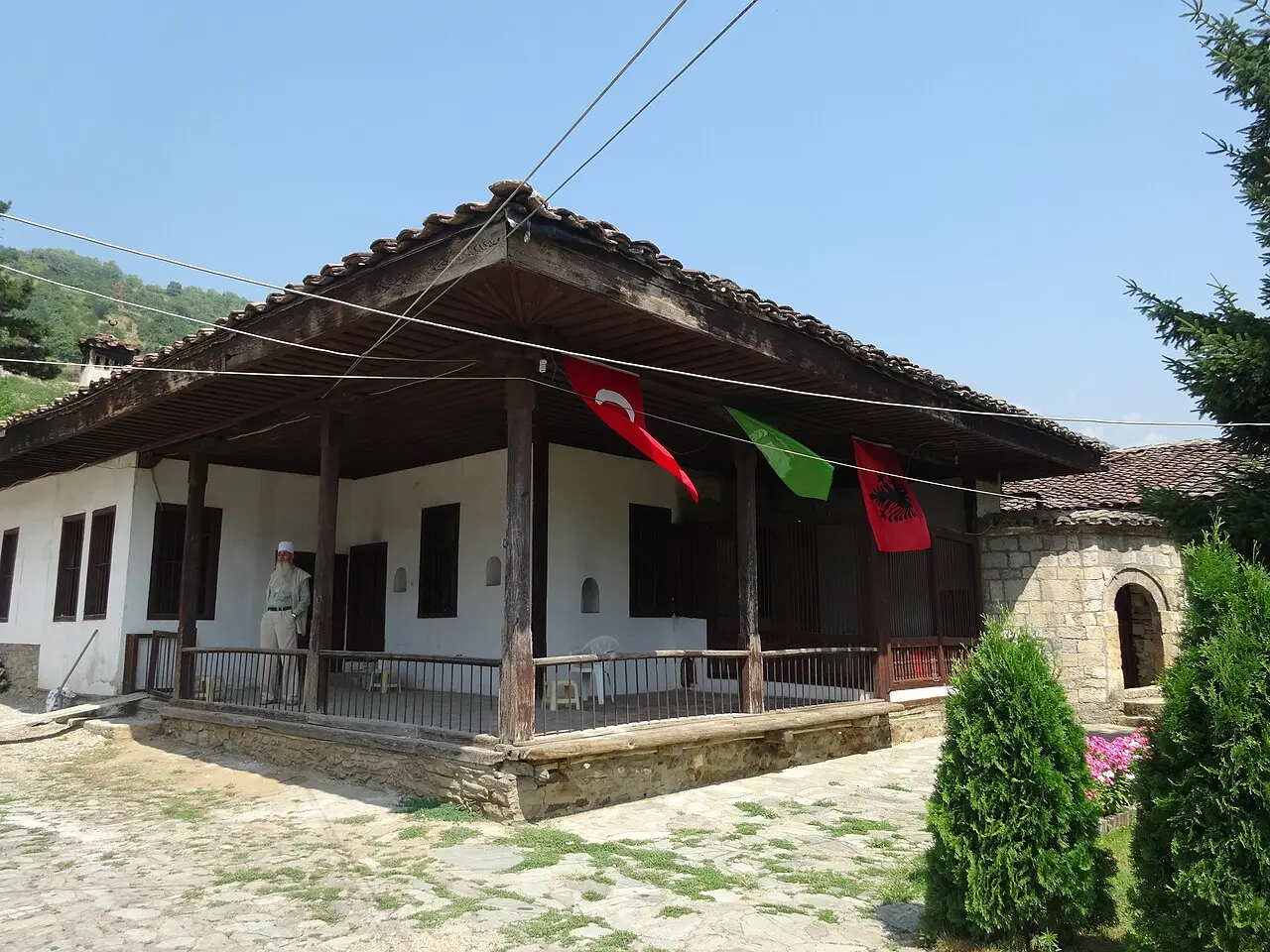 Wooden lodge buildings of the Arabati Baba tekke in Tetovo among trees