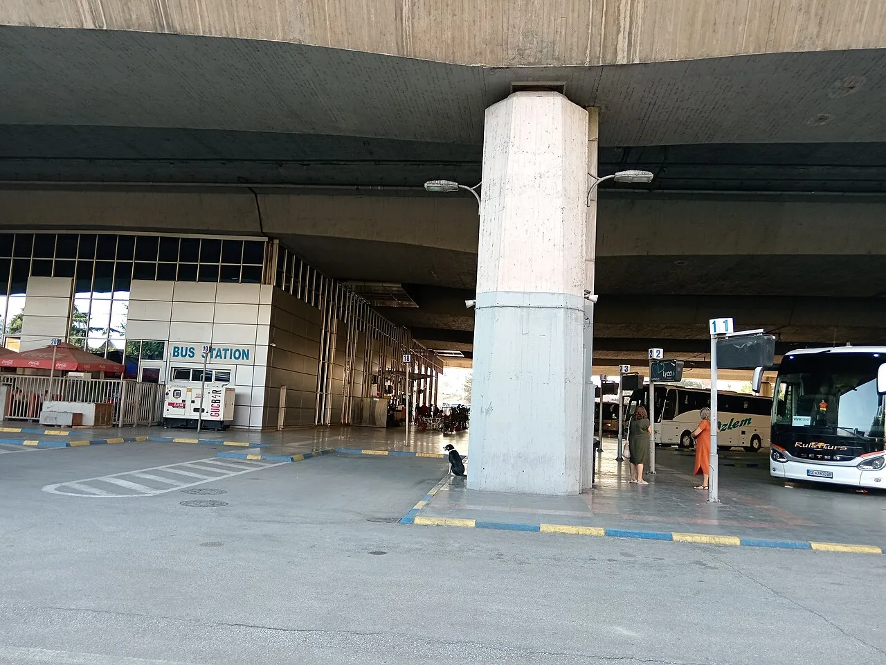 Coach bays and the BUS STATION sign at Skopje's central bus station