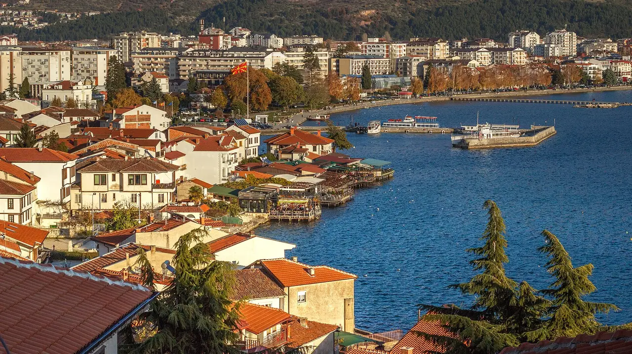 Ohrid old town with red roofs tumbling down to the blue water of Lake Ohrid
