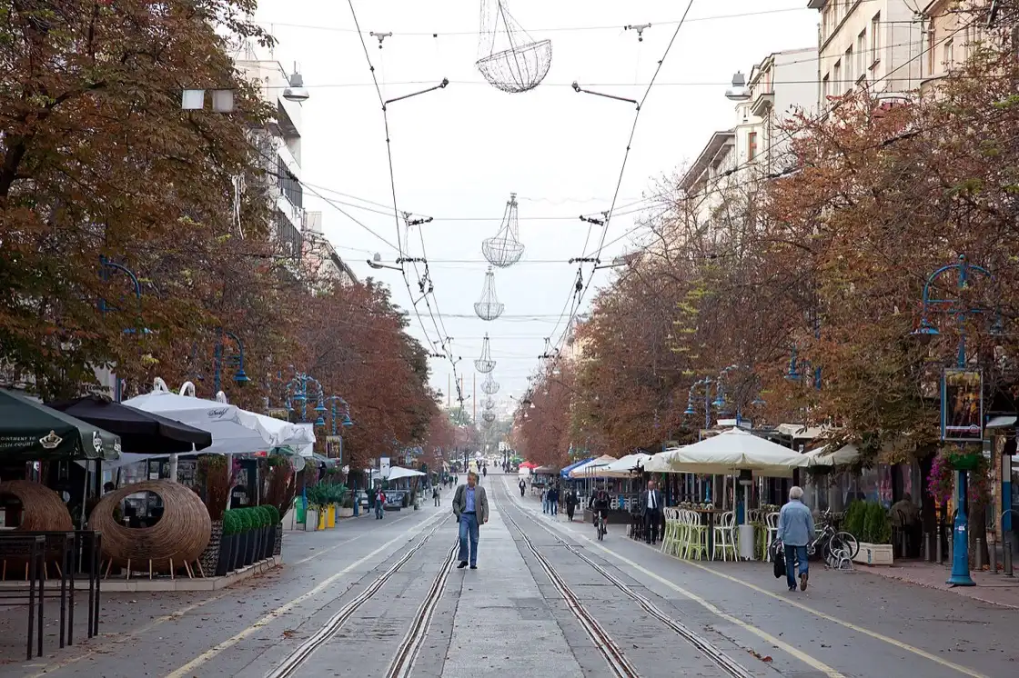 The pedestrianised Vitosha Boulevard in Sofia, lined with café terraces and autumn trees