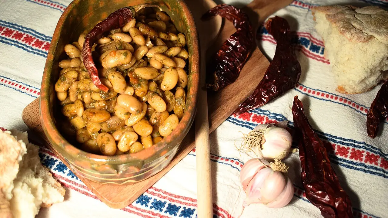 Tavče gravče - Macedonian baked beans in a clay pot with dried peppers and garlic